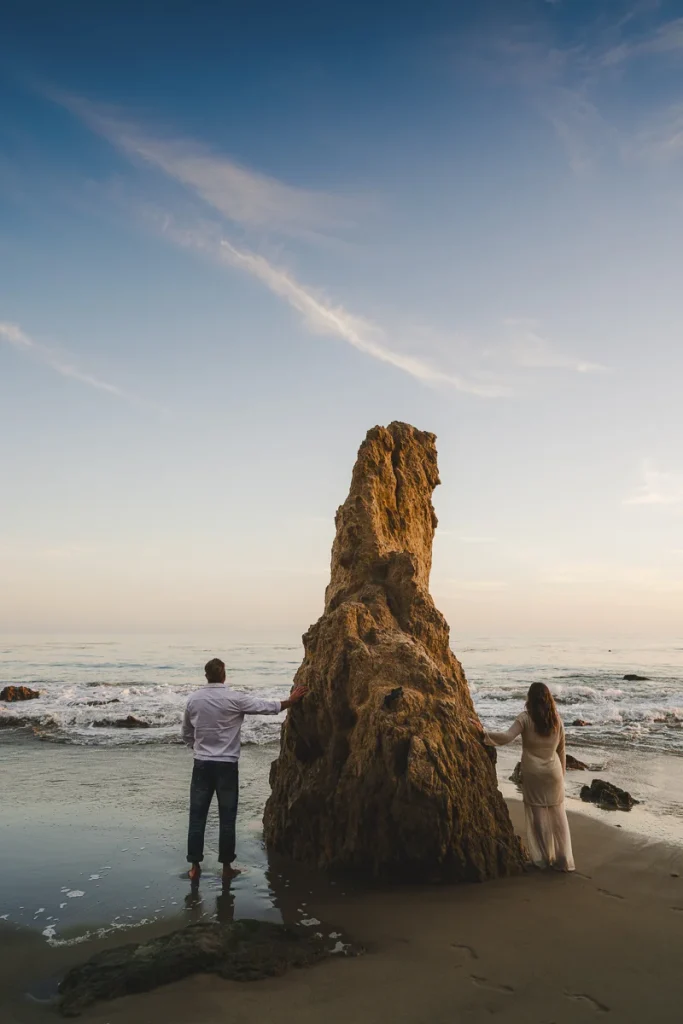 Engaged Couple watching sunset at El Matador Beach