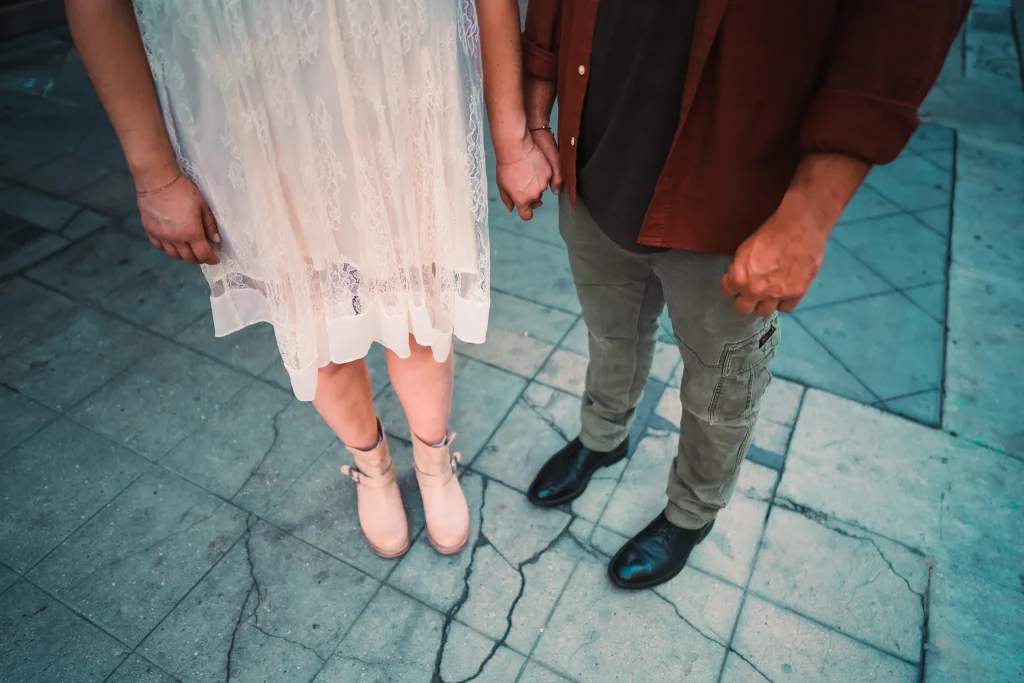 Couple standing side by side in downtown