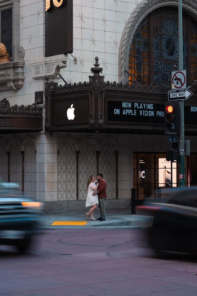 Engaged couple embracing with motion blur in downtown