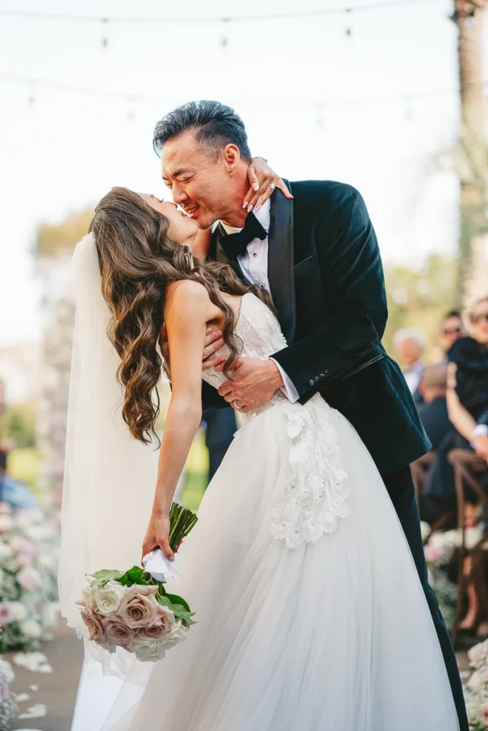 Kissing couple during ceremony at Talega Golf Club