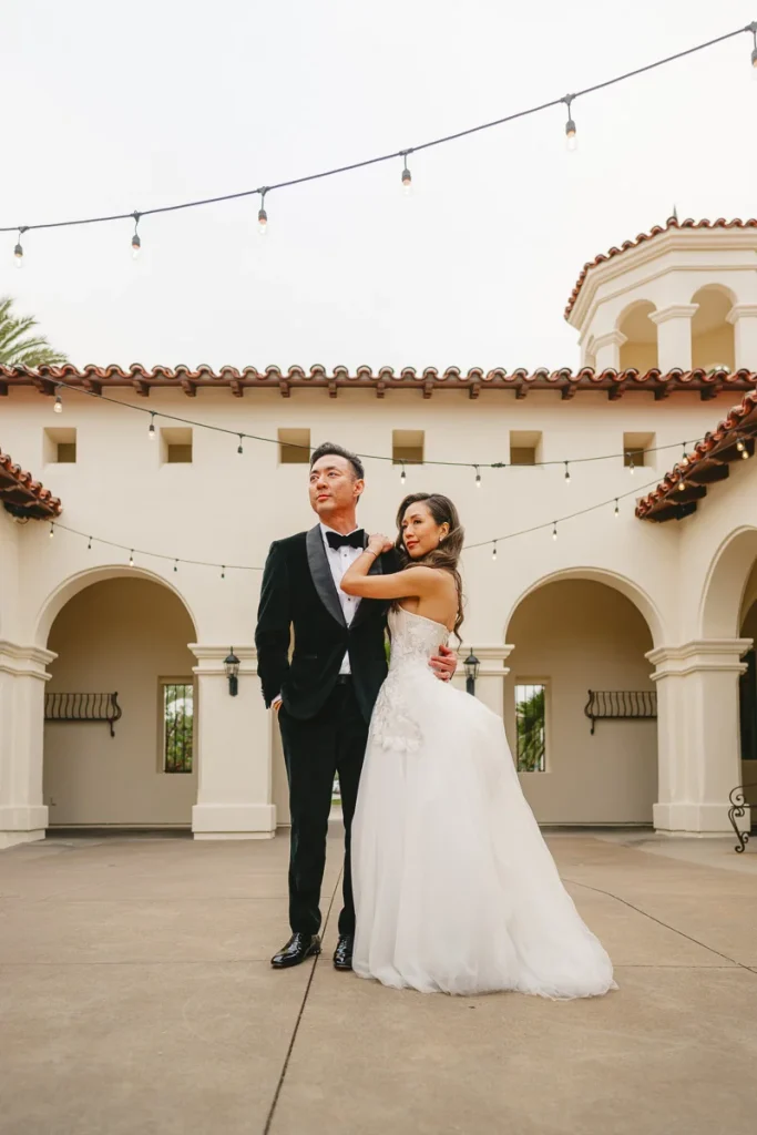 Bride and groom pose for a portrait at talega golf club