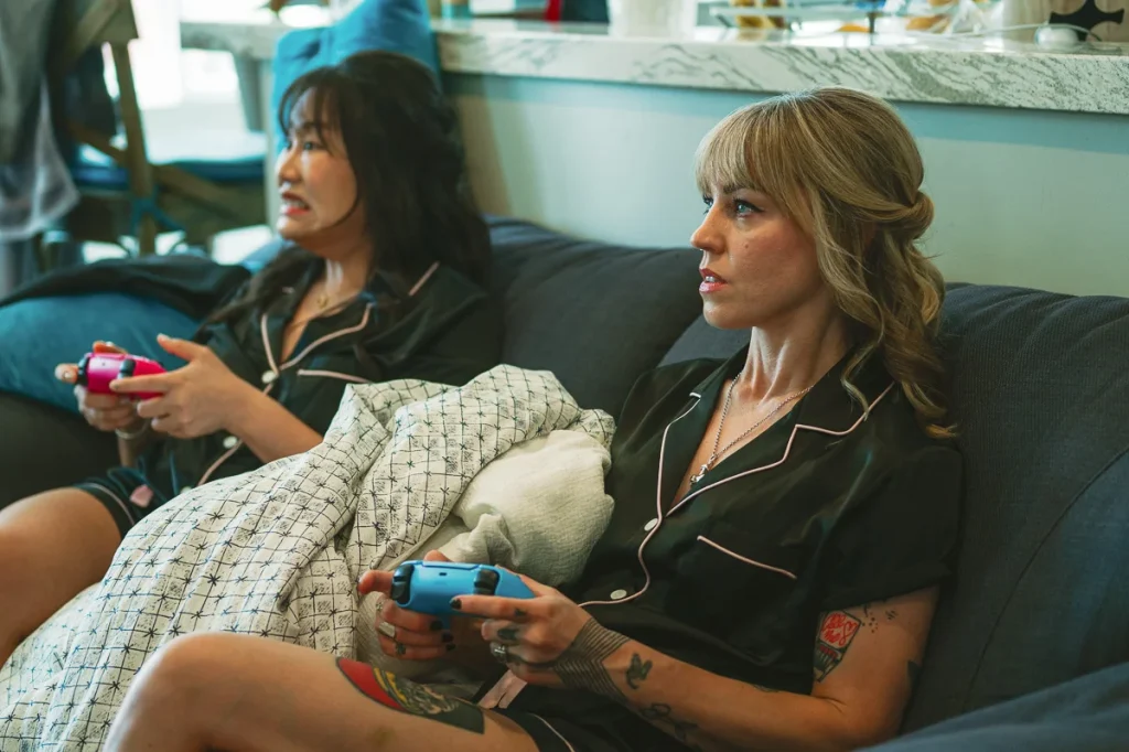Bridesmaids playing video game