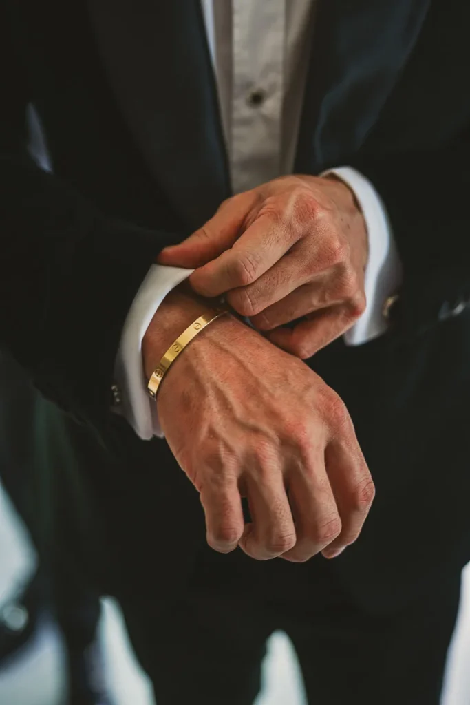 Groom adjusting his bracelet