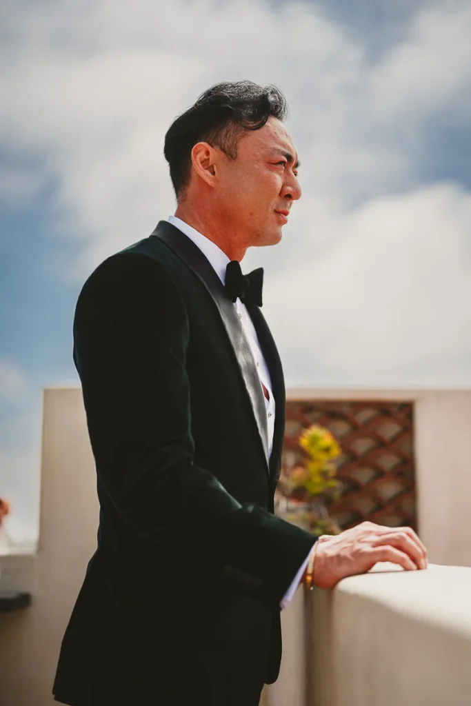 Portrait of groom on rooftop
